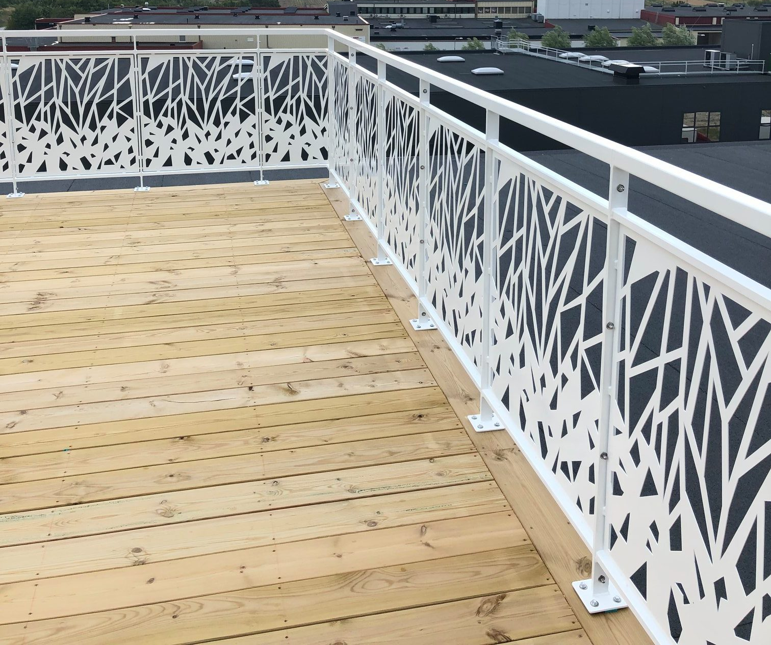Branch-pattern terrace railing, shown at a corner
